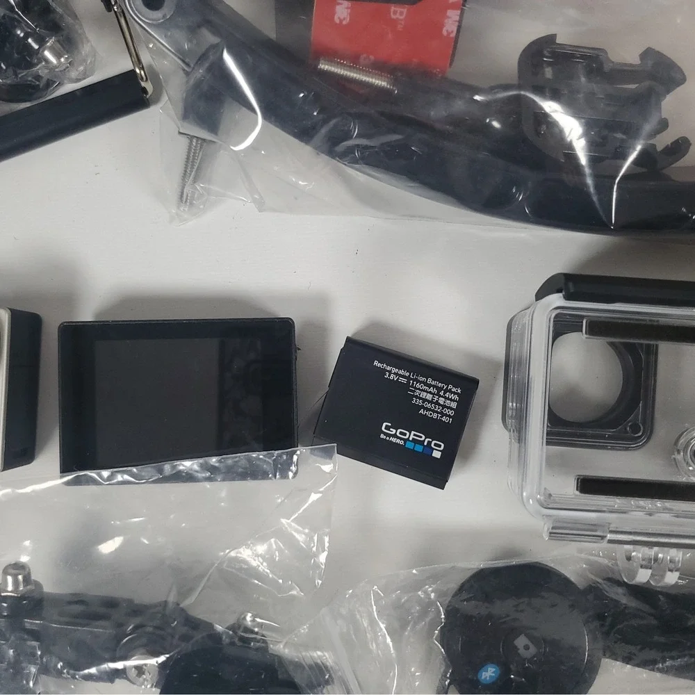GoPro Hero4, Two Batteries, And Accessories Lot. Mounts, Body And Head Harness